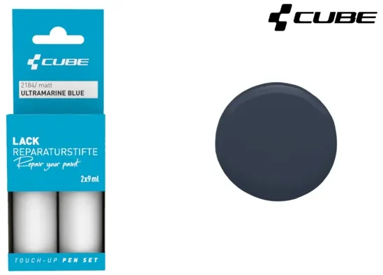 Das CUBE Lackstift Set ULTRAMARINE BLUE matt 2184 besteht aus zwei 12ml Lackstiften in blauer Verpackung, die neben einem kreisförmigen Farbmuster in Ultramarinblau abgebildet sind.